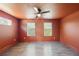 Modern bedroom featuring hardwood floors, a ceiling fan, neutral blinds, and natural light at 3087 Alston Dr, Decatur, GA 30032