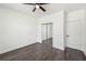 Bright bedroom featuring modern ceiling fan, dark hardwood floors and closet with mirrored sliding doors at 3087 Alston Dr, Decatur, GA 30032