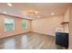 Spacious bonus room with wood floors, wet bar, and natural light from two large windows at 3087 Alston Dr, Decatur, GA 30032