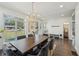 Bright dining room features hardwood floors, large windows, stylish lighting, and a modern design at 3087 Alston Dr, Decatur, GA 30032