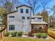 Rear exterior view of a modern home with a covered porch and well-maintained landscaping at 3087 Alston Dr, Decatur, GA 30032