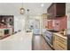 Modern kitchen with island seating, stainless steel appliances, and stylish pendant lighting at 3087 Alston Dr, Decatur, GA 30032