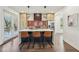 Modern kitchen featuring a large island, stainless steel appliances, and a door to the back deck at 3087 Alston Dr, Decatur, GA 30032