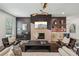 Stylish living room features modern lighting, fireplace and open shelving in a comfortable layout at 3087 Alston Dr, Decatur, GA 30032