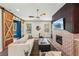 Cozy living room with fireplace, hardwood floors and sliding barn doors to additional room at 3087 Alston Dr, Decatur, GA 30032