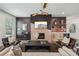 Inviting living room with a fireplace, bar area, stylish light fixture, and comfortable seating at 3087 Alston Dr, Decatur, GA 30032