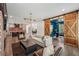 Open concept living room and kitchen area featuring hardwood floors and a sliding barn door at 3087 Alston Dr, Decatur, GA 30032