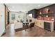 Open-concept living room features stylish decor, fireplace, and a wet bar with wine cooler at 3087 Alston Dr, Decatur, GA 30032