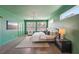 Spacious green primary bedroom with a serene atmosphere and stylish furniture at 3087 Alston Dr, Decatur, GA 30032
