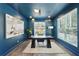 Chic blue office with a modern desk, contemporary lighting, and large windows at 3087 Alston Dr, Decatur, GA 30032