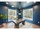 Bright office space featuring modern lighting, two windows, and a gray work desk at 3087 Alston Dr, Decatur, GA 30032