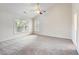 Spacious bedroom features a ceiling fan and large windows, allowing ample natural light at 3515 Mcclure Woods Dr, Duluth, GA 30096