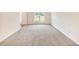 Bright bedroom featuring plush carpet and a large window with plenty of natural light at 3515 Mcclure Woods Dr, Duluth, GA 30096