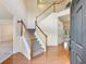 Light-filled foyer featuring hardwood floors, stairs, and inviting entrance at 3515 Mcclure Woods Dr, Duluth, GA 30096