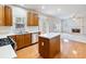 Bright kitchen with stainless steel appliances, an island and a gas cooktop stove at 3515 Mcclure Woods Dr, Duluth, GA 30096