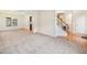 Open living area with hardwood floors, staircase, and access to the dining room at 3515 Mcclure Woods Dr, Duluth, GA 30096