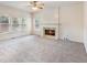 Inviting living room with a fireplace and large windows providing plenty of natural light at 3515 Mcclure Woods Dr, Duluth, GA 30096