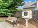 Outdoor library box with bench beside a sidewalk for enjoying community reading at 3515 Mcclure Woods Dr, Duluth, GA 30096