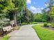 Curving community walking path surrounded by lush landscaping and mature trees at 3515 Mcclure Woods Dr, Duluth, GA 30096