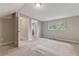 Bright bedroom with neutral walls, carpet, and doorways to adjacent rooms at 511 Ashburton Ave, Decatur, GA 30032