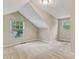 Upstairs bedroom featuring carpet and natural lighting at 511 Ashburton Ave, Decatur, GA 30032