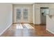 Bright kitchen view with stainless steel appliances, hardwood floors, and patio access at 511 Ashburton Ave, Decatur, GA 30032