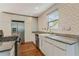 Chic kitchen with stainless steel appliances, herringbone tile backsplash, and granite countertops at 511 Ashburton Ave, Decatur, GA 30032