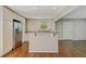 Eat-in kitchen with stainless steel appliances, island, and great hardwood floors at 511 Ashburton Ave, Decatur, GA 30032