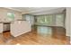 Open-concept living area with kitchen island and hardwood flooring at 511 Ashburton Ave, Decatur, GA 30032