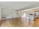 Open concept living area featuring hardwood floors that flows into kitchen with island at 511 Ashburton Ave, Decatur, GA 30032
