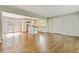 Bright, open living space with hardwood floors, french doors, and view of kitchen at 511 Ashburton Ave, Decatur, GA 30032