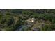 Aerial view of home in wooded neighborhood, near community pool and tennis courts at 1140 Promontory Drive, Marietta, GA 30062