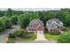 Charming two-story brick home with a landscaped yard, a front porch, and a two-car garage at 1140 Promontory Drive, Marietta, GA 30062