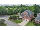 Beautiful aerial view of a two-story brick home with a well-manicured lawn and a two-car garage at 1140 Promontory Drive, Marietta, GA 30062