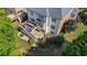 Aerial view of backyard showing deck, patio, landscaping, retaining wall, and a small gas fireplace at 1140 Promontory Drive, Marietta, GA 30062
