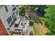 An aerial view shows a deck, patio, landscaping, gas fireplace, and a trampoline in the backyard at 1140 Promontory Drive, Marietta, GA 30062