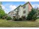 Expansive backyard with large deck, stone fireplace, lawn and mature landscaping perfect for outdoor entertaining and relaxation at 1140 Promontory Drive, Marietta, GA 30062