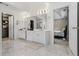 A stunning bathroom with double vanity, marble floors, and adjacent walk-in closet and bedroom at 1140 Promontory Drive, Marietta, GA 30062