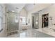 Luxurious bathroom with soaking tub, glass shower, double vanity, and walk-in closet at 1140 Promontory Drive, Marietta, GA 30062