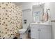 Bathroom featuring a white vanity, patterned shower curtain and blue bath mat at 1140 Promontory Drive, Marietta, GA 30062
