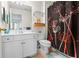 A bathroom with white vanity and brown floral-patterned shower curtain at 1140 Promontory Drive, Marietta, GA 30062
