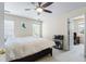 Bedroom featuring a dark ceiling fan, ample sunlight, and a cozy reading corner at 1140 Promontory Drive, Marietta, GA 30062