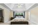 Tranquil bedroom features a trey ceiling, plush carpeting, and natural light at 1140 Promontory Drive, Marietta, GA 30062