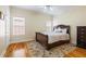 Cozy bedroom with hardwood floors, neutral walls, and a matching dresser and headboard at 1140 Promontory Drive, Marietta, GA 30062
