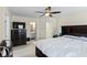 A bedroom with large, dark dresser and a king bed at 1140 Promontory Drive, Marietta, GA 30062