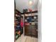 A custom walk-in closet with shelves, drawers, and ample space for organization and storage at 1140 Promontory Drive, Marietta, GA 30062