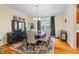 Elegant dining room with hardwood floors, a large window, and a stylish chandelier above the table at 1140 Promontory Drive, Marietta, GA 30062