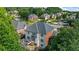 An aerial view of an attractive backyard featuring a deck, patio, and stairs leading down to the yard at 1140 Promontory Drive, Marietta, GA 30062