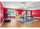 Spacious game room with hardwood floors, table tennis, treadmill, and ample natural light, perfect for entertainment at 1140 Promontory Drive, Marietta, GA 30062