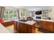 Spacious kitchen featuring an island with a cooktop, stainless steel appliances, and a breakfast nook at 1140 Promontory Drive, Marietta, GA 30062